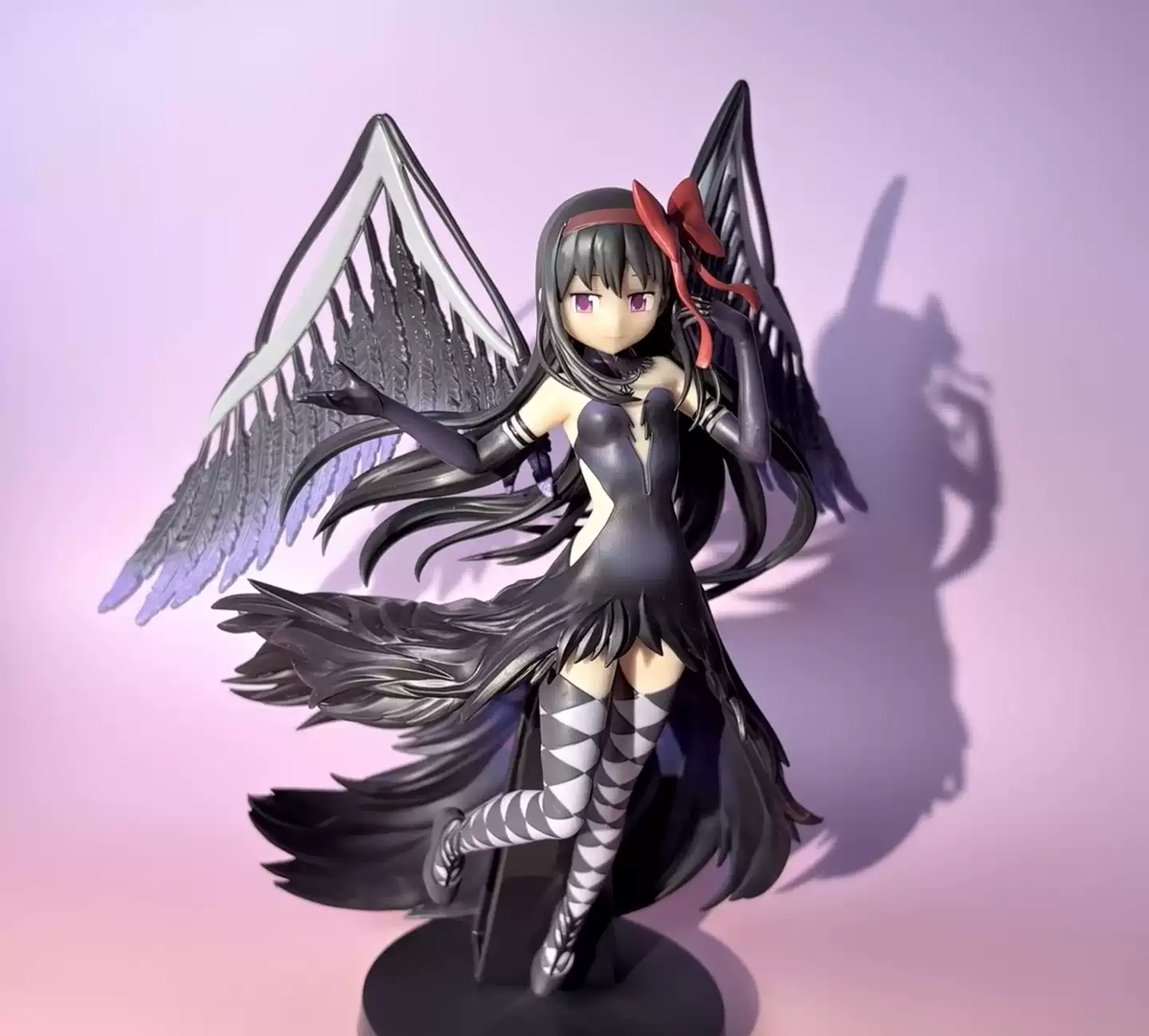 Homura Akemi figure from Madoka Magica by Shadora featuring her in a dynamic pose with detailed costume and vibrant colors.