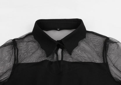 Eprolo siyah transparan mini elbise with sheer fabric and fitted design, showcased on a hanger.