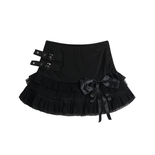 Eprolo low-rise bow mini skirt in black fabric, stylish and fitted, shown on a model.