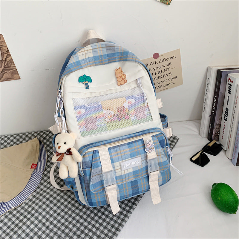 Eprolo Kareli Japon tarzı sırt çantası with black and white checkered pattern, front zipper pocket and adjustable straps.