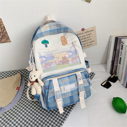Eprolo Kareli Japon tarzı sırt çantası with black and white checkered pattern, front zipper pocket and adjustable straps.