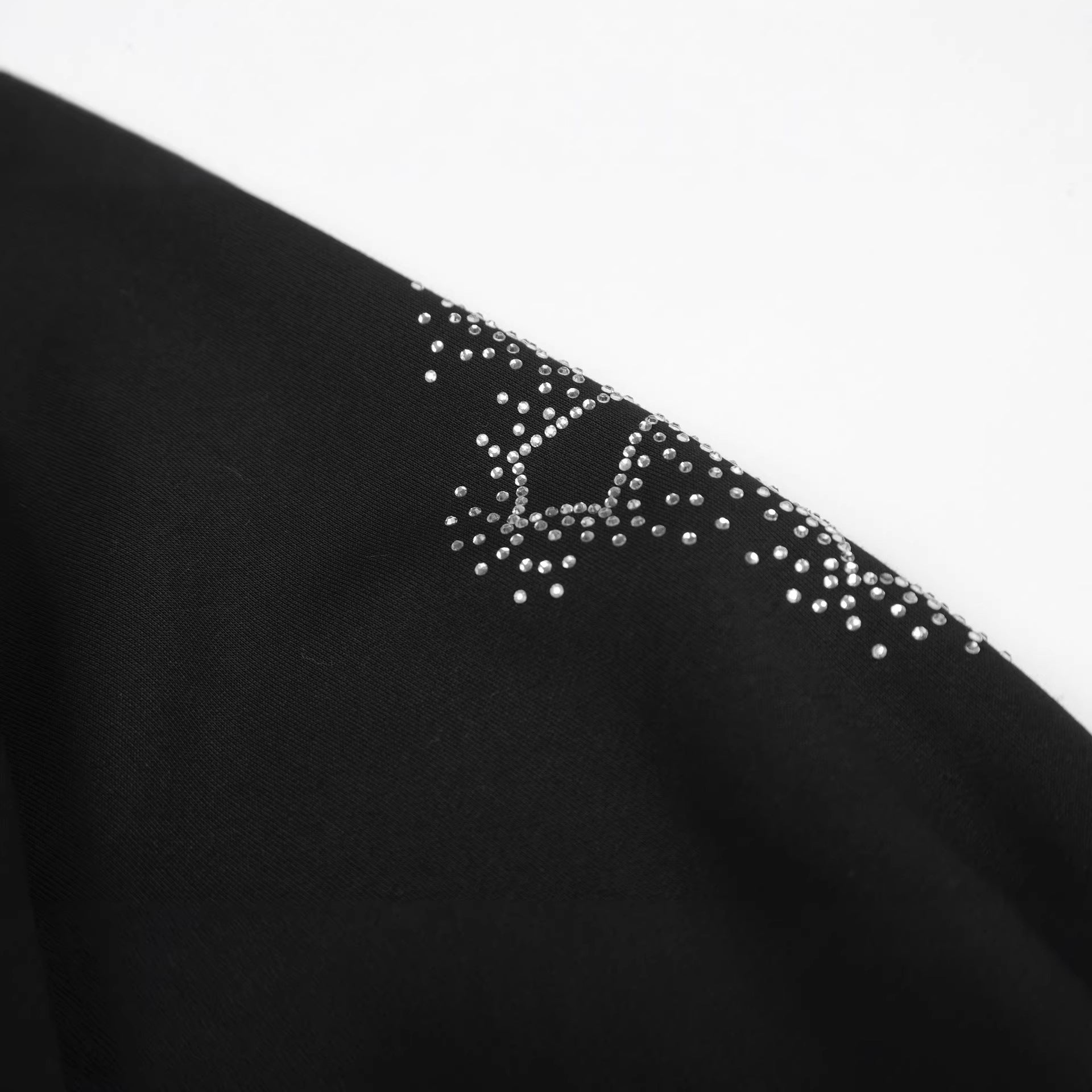 Eprolo zipper hoodie with cross pattern and embellished stones, featuring a casual fit and detailed design.