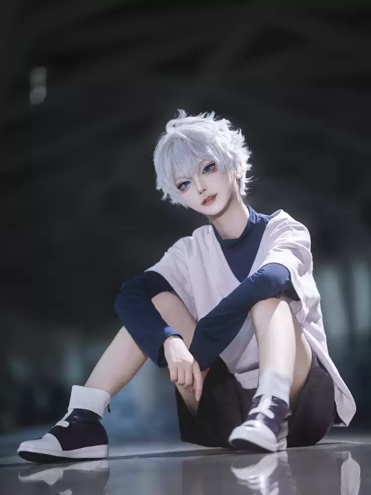 Killua Zoldyck cosplay with wig from Hunter X Hunter by Shadora, featuring character costume and styled blue hair.