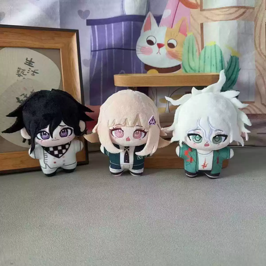 Soft plush toys of Kokichi Oma, Chiaki Nanami, and Nagito Komaeda from Danganronpa by Shadora, showing detailed character features.
