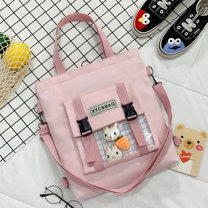 Transparent canvas shoulder bag with colorful printed design, featuring a spacious main compartment and adjustable strap by eprolo.