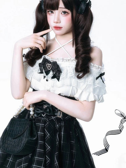 White blouse and skirt set with lace details and off-shoulder design by eprolo, featuring a bow on the blouse.