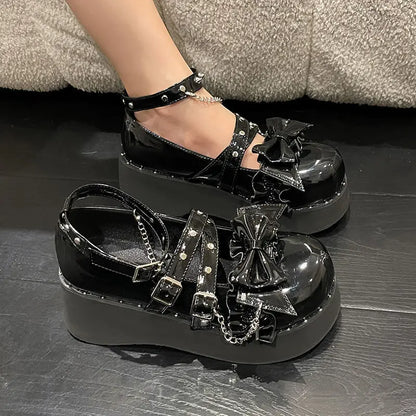 Eprolo Gothic Lolita platform Mary Jane shoes with black patent finish and chunky heel, detailed with decorative straps and buckles.