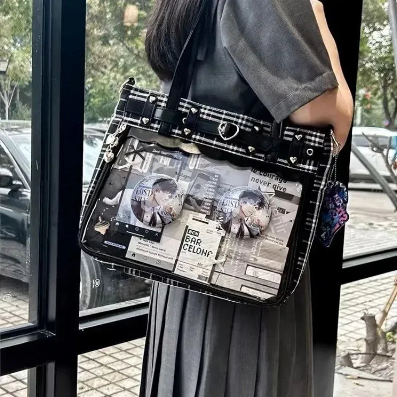Eprolo Ekose desenli şeffaf cepli Ita bag with black handles and metal hardware, showcasing its stylish and functional design.