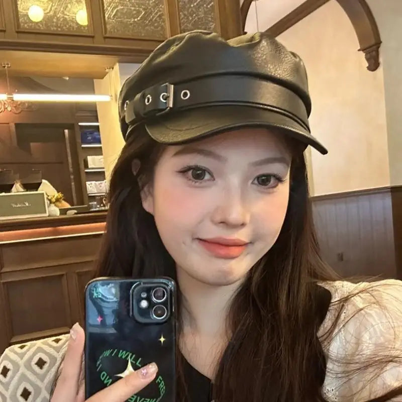 Vintage black leather grunge hat from eprolo featuring a classic, stylish design with a slightly worn, textured appearance.