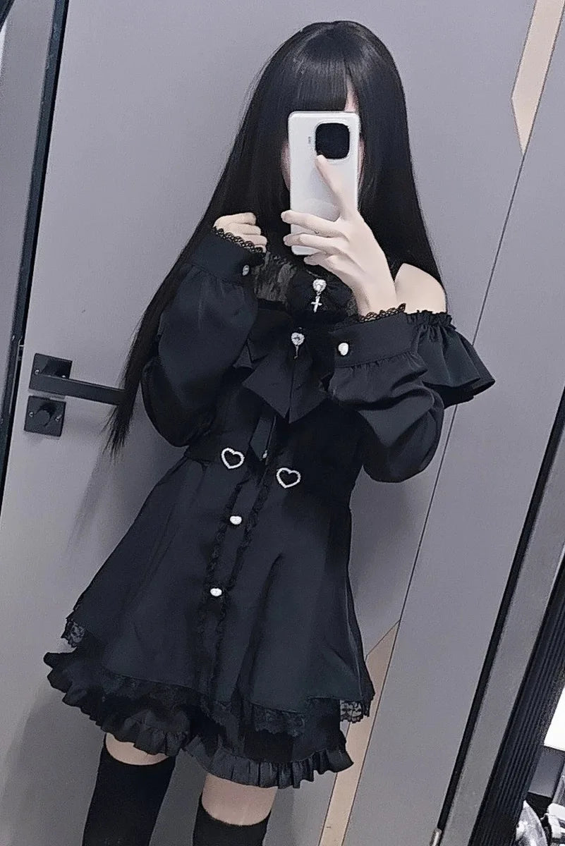 Eprolo low shoulder long sleeve dress and shorts two-piece set, black fabric with stylish design, shown on a model.