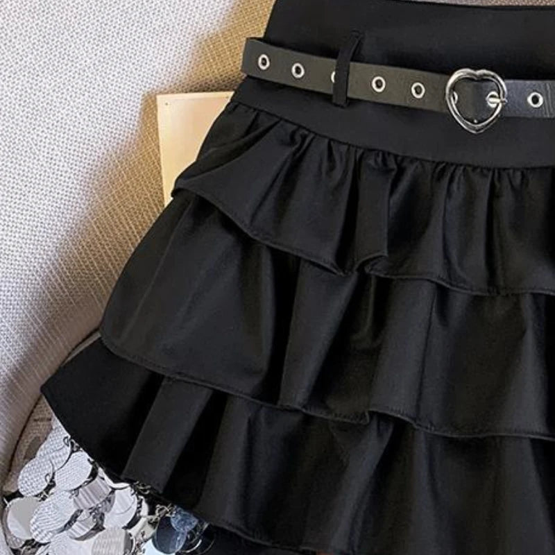 High-waisted mini skirt with chain details and ruffled hem from eprolo, showcasing its stylish design and vibrant fabric.