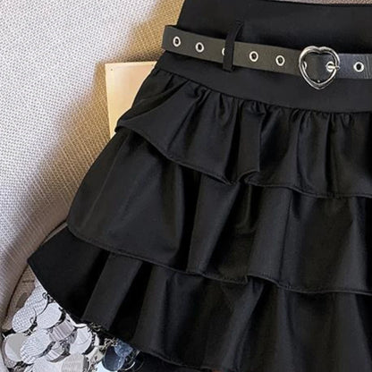 High-waisted mini skirt with chain details and ruffled hem from eprolo, showcasing its stylish design and vibrant fabric.