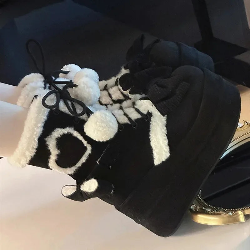 Fiyonk detaylı platform Şirin bot by eprolo showing beige color with bow embellishment and chunky sole on a neutral background.