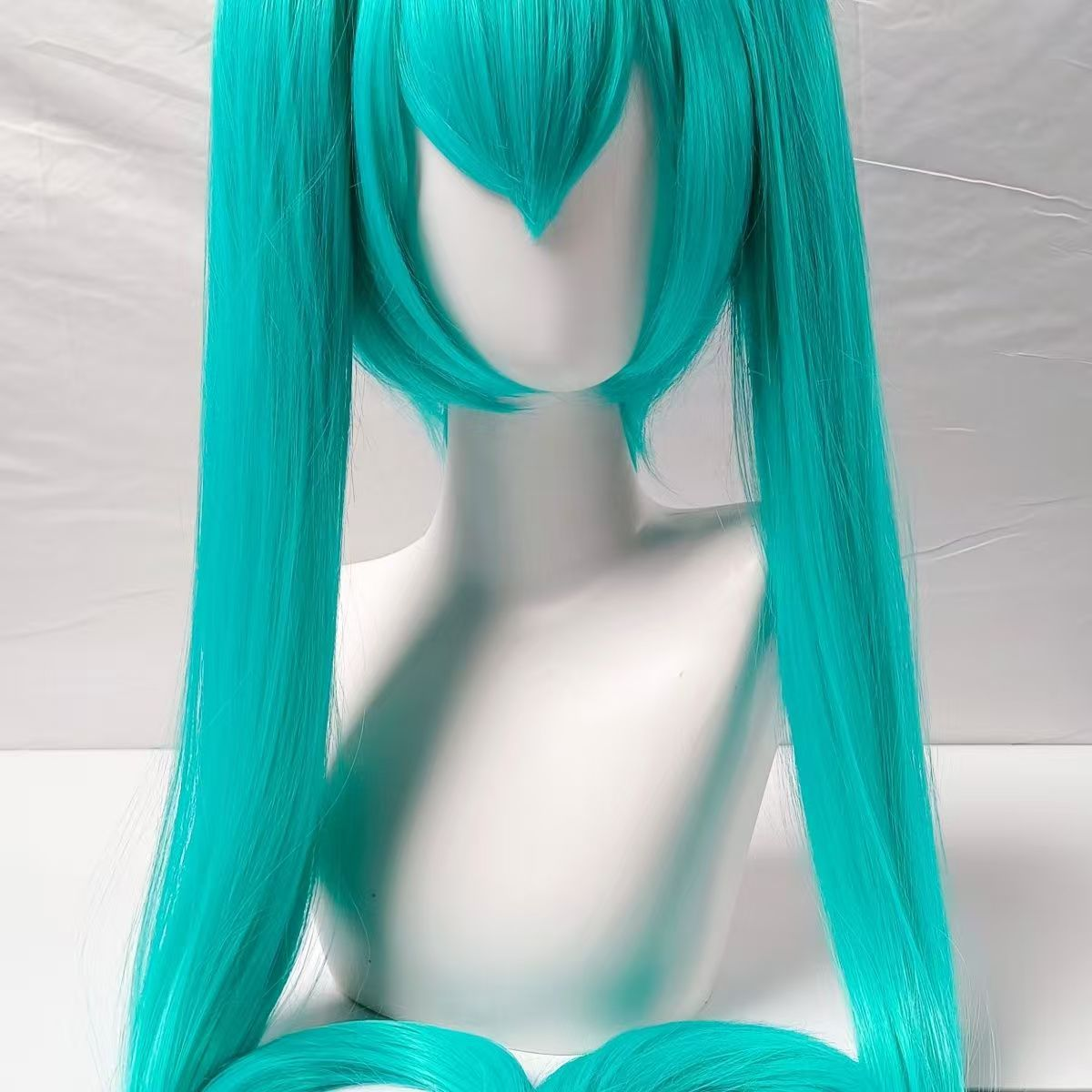 Shadora Mesmerizer Miku Cosplay costume with colorful wig and accessories displayed on a mannequin.