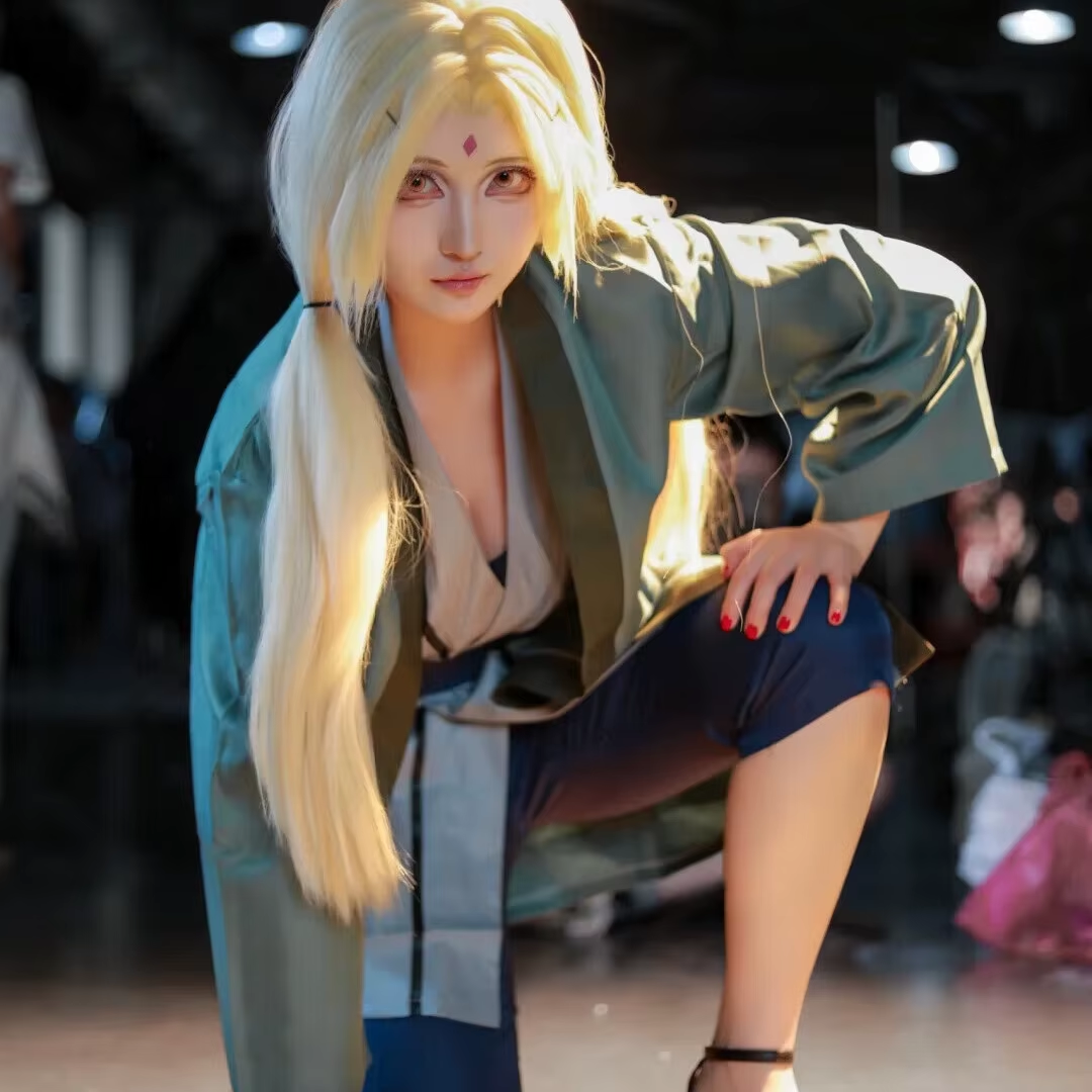 Tsunade cosplay costume by Shadora featuring a detailed outfit and wig, capturing the character's iconic look.