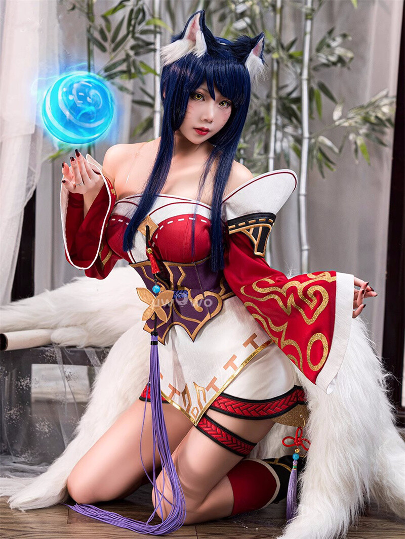 High-quality Ahri cosplay costume with matching wig from Shadora, featuring detailed design and vibrant colors.