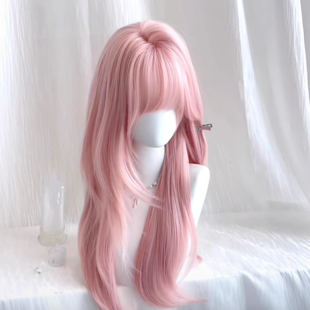 Shadora Pembe Peruk with long, wavy pink hair, styled for costume or fashion use.