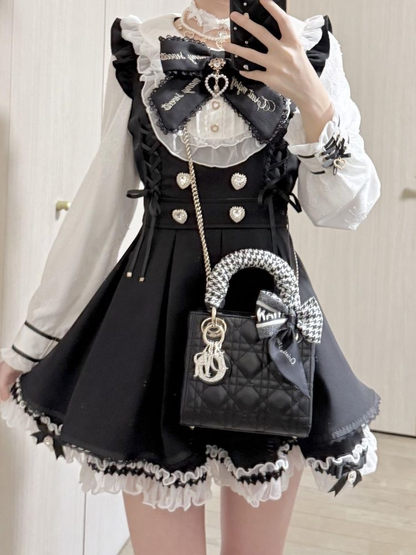 Shadora long-sleeve mini dress set with ruffled details, featuring a stylish and feminine design, displayed on a hanger.