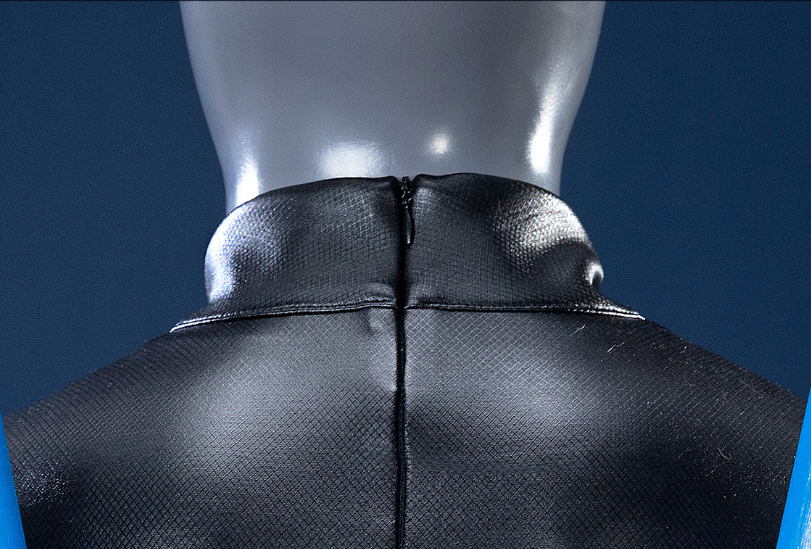 Nightwing Grayson cosplay costume by Shadora featuring a sleek black and blue suit with a mask and utility belt.