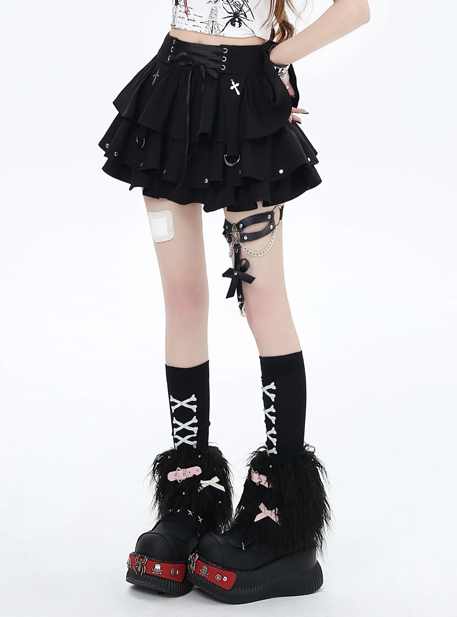 Shadora black high-waisted textured mini skirt shown on a model, highlighting the fitted silhouette and stylish design.