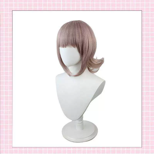 Chiaki Nanami cosplay with wig from Danganronpa, featuring detailed costume and styled pink hair in natural lighting.