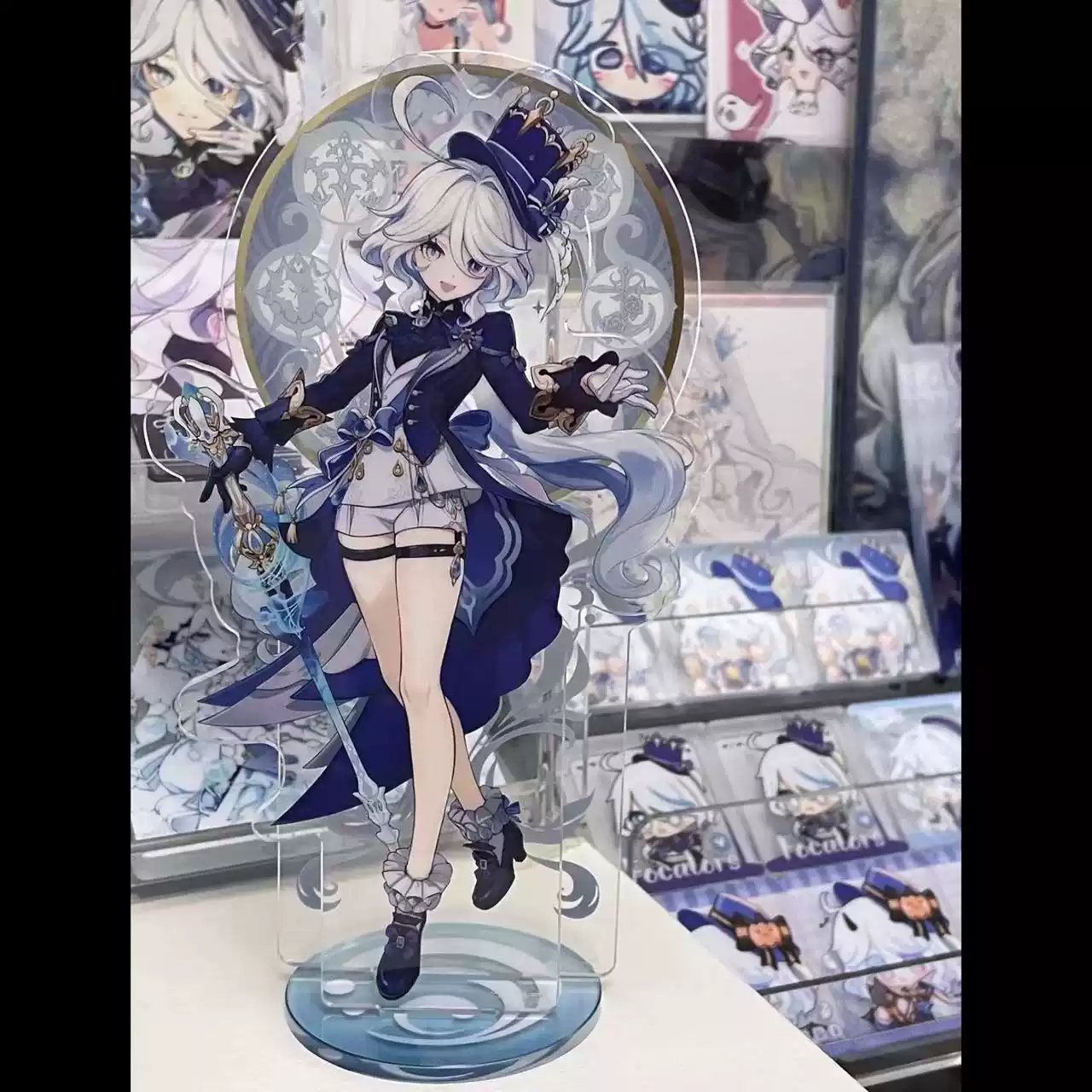 Acrylic stand of Furina from Genshin Impact by Shadora, featuring detailed character artwork on a clear display stand.