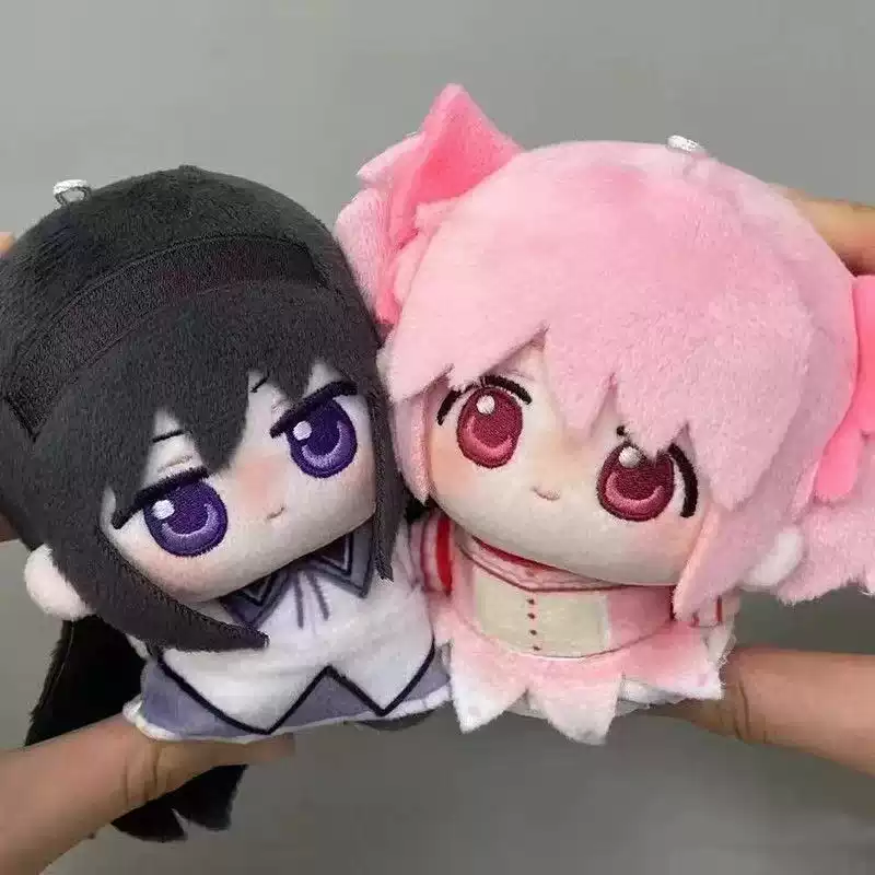 Shadora Madoka and Homura plush dolls sitting together, soft fabric, detailed character designs from the anime series.